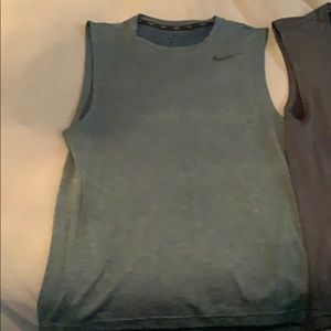 Two mens Nike sleeveless shirts